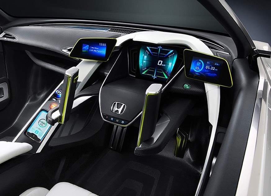 Honda EV-STER / 2011
A typical steering wheel was replaced by two joysticks on the Honda EV-STER. Although this certainly adds a futuristic look, the redesign wasn’t a vanity project. The twin-level s ...