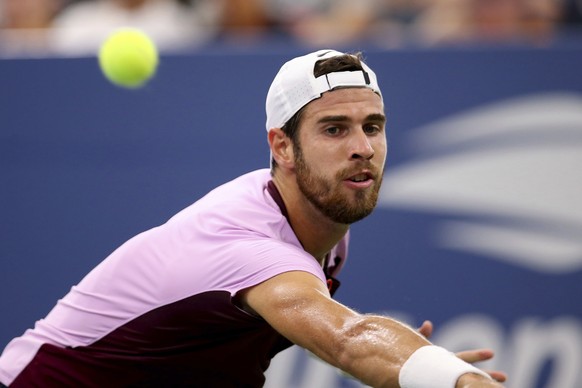 Karen Khachanov, of Russia, returns a shot to Pablo Carreno Busta, of Spain, during the fourth round of the U.S. Open tennis championships, Sunday, Sept. 4, 2022, in New York. (AP Photo/Andres Kudacki ...