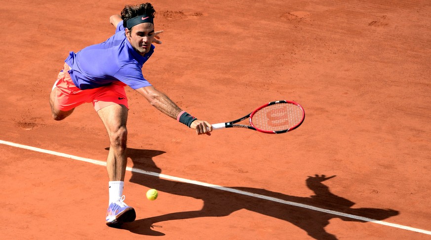 epa04780485 Roger Federer of Switzerland in action against his compatriot Stan Wawrinka during their quarterfinal match for the French Open tennis tournament at Roland Garros in Paris, France, 02 June ...