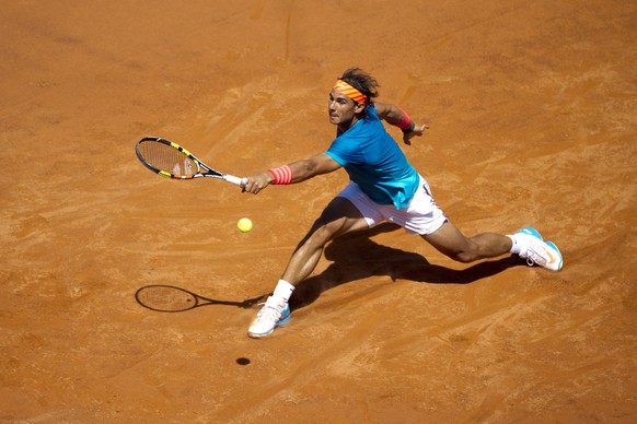Rafael Nadal, of Spain, returns the ball to Marsel Ilhan, of Turkey, during their match at the Italian Open tennis tournament, in Rome, Wednesday, May 13, 2015. (AP Photo/Andrew Medichini)