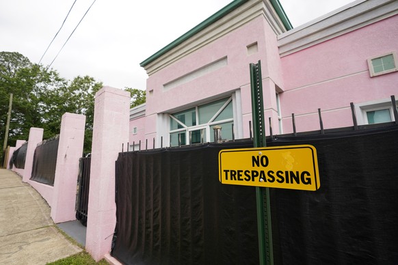 FILE - The Jackson Women&#039;s Health Organization clinic, a state-licensed abortion clinic in Jackson, Miss., is seen on May 19, 2021. Also known as &quot;The Pink House,&quot; it is shrouded with a ...