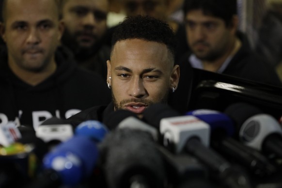 Brazilian soccer player Neymar speaks to journalists as he leaves a police station where he spoke to police in Rio de Janeiro, Brazil, Thursday, June 6, 2019. Rio de Janeiro police said Thursday that  ...