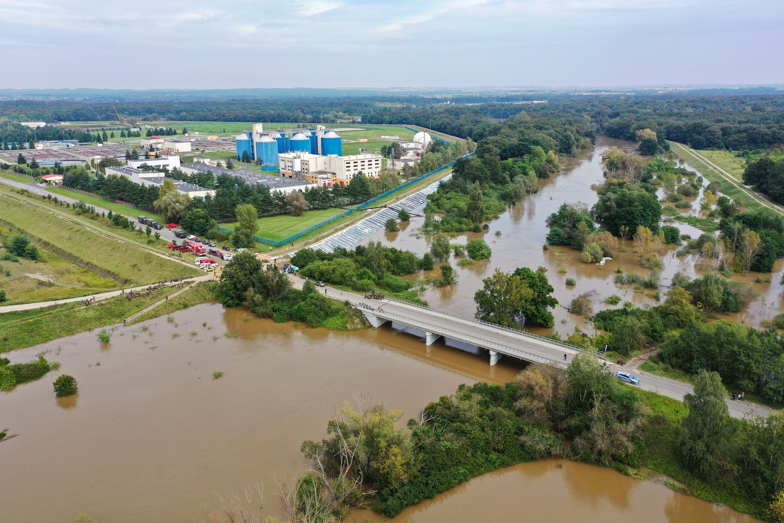 epa11613680 An aerial picture taken with a drone shows the high water level in the river Bystrzyca in Wroclaw, southwestern Poland, 19 September 2024. The low-pressure system Boris brought heavy rain  ...