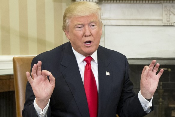 epa05625919 President-elect Donald Trump delivers remarks to members of the news media during a meeting with US President Barack Obama (not pictured) in the Oval Office of the White House in Washingto ...