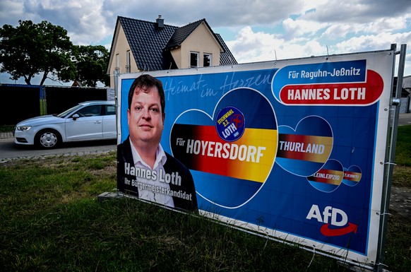 epa10723719 An Alternative for Germany (AfD) election campaign poster shows the candidate for new mayor in Raguhn-Jessnitz town, Hannes Loth, Raguhn-Jessnitz, in Saxony-Anhalt, Germany 03 July 2023. H ...