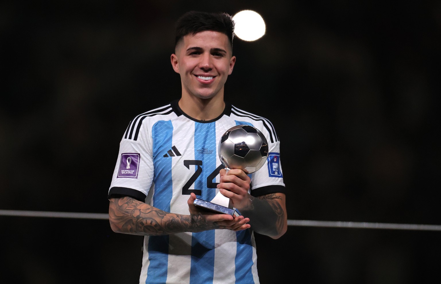 epa10373226 FIFA 2022 Young Player award winner Enzo Fernandez of Argentina poses with his trophy after the FIFA World Cup 2022 Final between Argentina and France at Lusail stadium, Lusail, Qatar, 18  ...