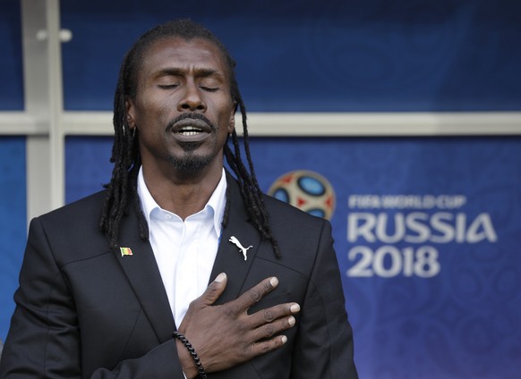 Senegal&#039;s head coach Aliou Cisse listens the national anthem ahead the group H match between Poland and Senegal at the 2018 soccer World Cup in the Spartak Stadium in Moscow, Russia, Tuesday, Jun ...