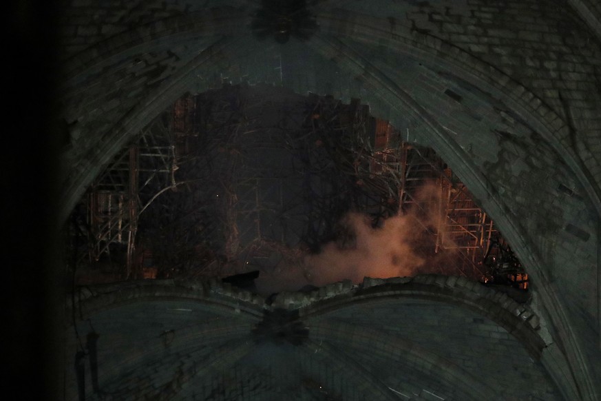 epa07509134 General view of the roof of the Notre-Dame Cathedral after a massive fire in Paris, France, late 15 April 2019. A fire started in the late afternoon in one of the most visited monuments of ...