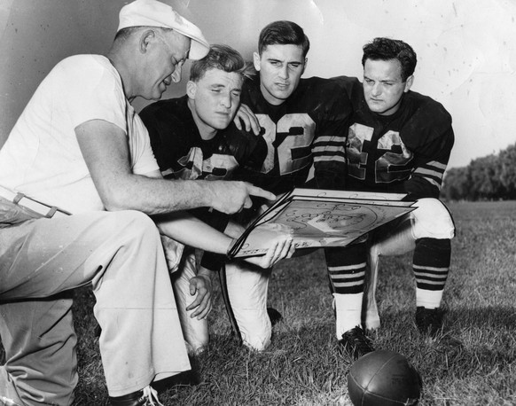 January 19, 2015, Chicago, IL, USA: George Halas, left, owner and coach of the Chicago Bears, explains diagramed plays to his quarterbacks Bobby Layne, left, Johnny Lujack and Sid Luckman on Sept. 3,  ...