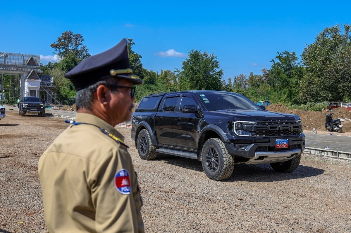 PAILIN PROVINCE, CAMBODIA - DECEMBER 27: A motorcycle carrying Cambodian Defense Minister General Tea Seiha and other officials leave the Ban Pakkad Border Checkpoint, following ceasefire talks betwee ...