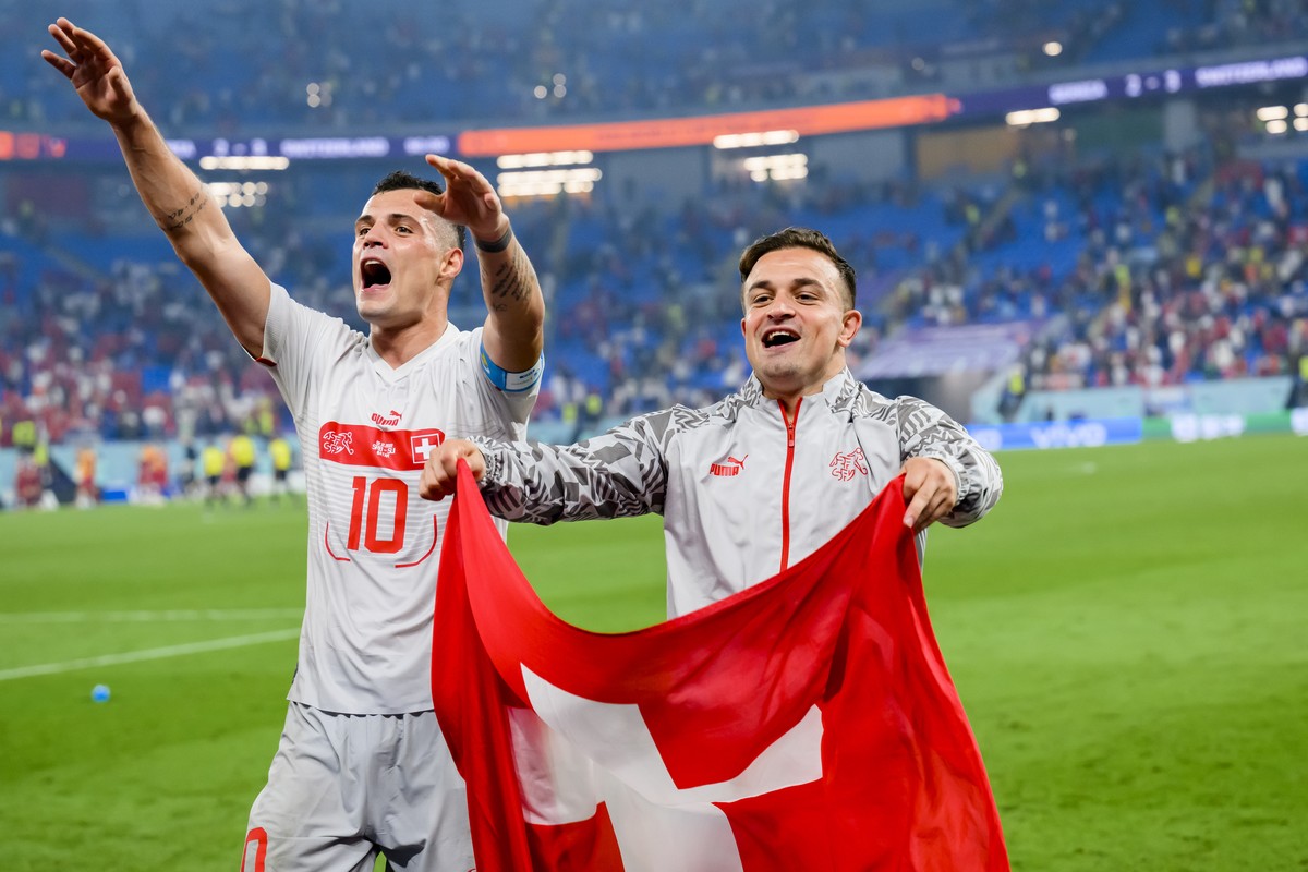 Switzerland's midfielder Granit Xhaka and Switzerland's midfielder Xherdan Shaqiri celebrate the victory and the qualification during the FIFA World Cup Qatar 2022 group G soccer match betwe ...