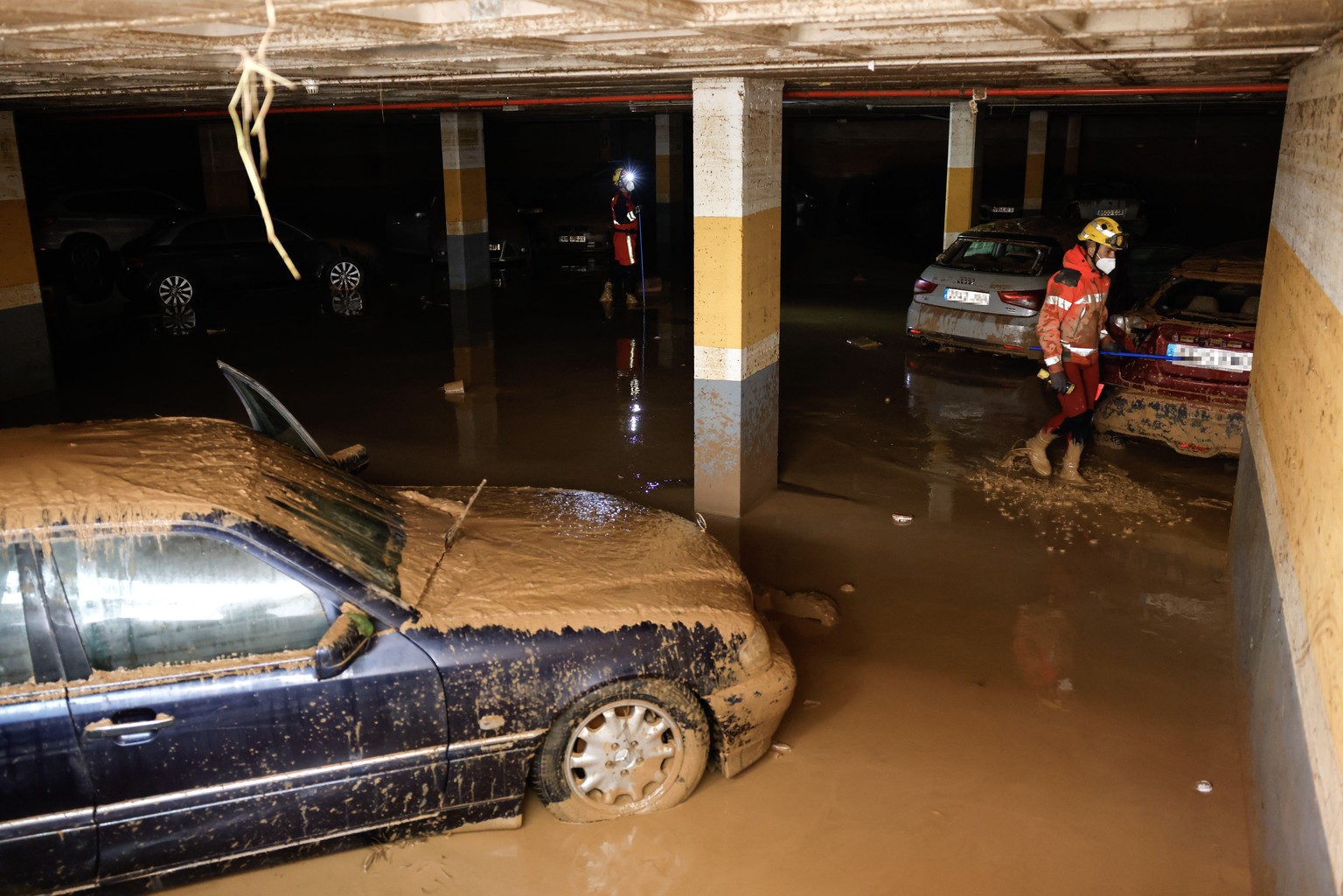epa11700630 Firefighters search for victims at an underground parking lot following last week&#039;s floods in the municipality of Sedavi, province of Valencia, Spain, 04 November 2024. The devastatin ...