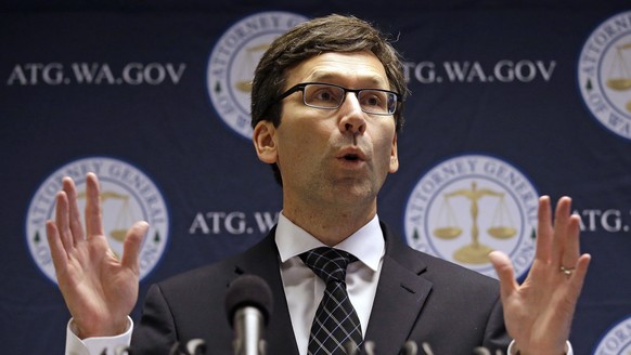 FILE - In this Nov. 28, 2017, file photo, Washington state Attorney General Bob Ferguson speaks at a news conference in Seattle. Ferguson is suing Google and Facebook, saying the companies failed to m ...