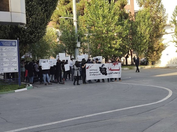 In this photo taken by an individual not employed by the Associated Press and obtained by the AP outside Iran shows students of the Sharif University of Technology attend a protest sparked by the deat ...