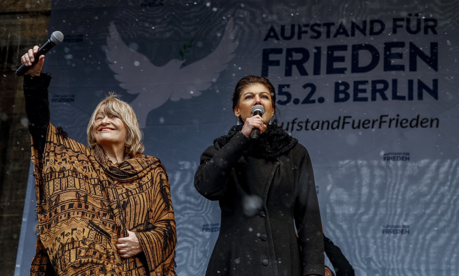 epa10490240 Women&#039;s rights activist and publisher Alice Schwarzer (L) and Sahra Wagenknecht (R) of Germany&#039;s The Left party Die Linke, speak during the demonstration &#039;Uprising for Peace ...