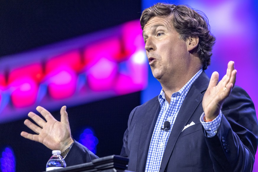 epa10748601 American conservative political commentator Tucker Swanson McNear Carlson speaks during the Turning Point Action Conference in West Palm Beach, Florida, USA, 15 July 2023. Turning Point Ac ...