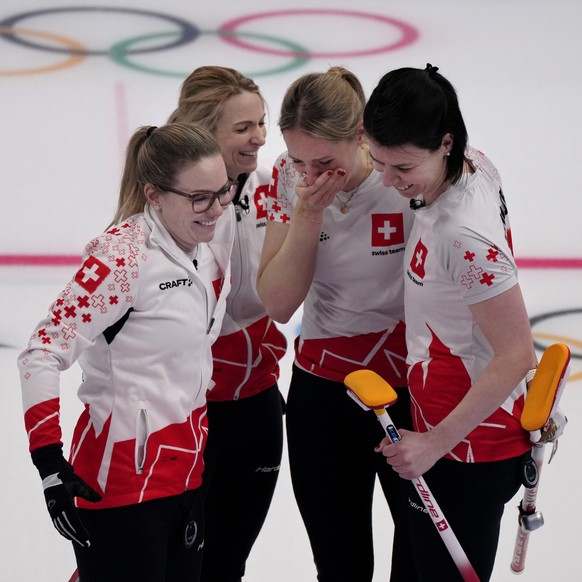 From left, Switzerland&#039;s Alina Paetz, Silvana Tirinzoni, Melanie Barbezat, Esther Neuenschwander, celebrate after winning the women&#039;s curling match against the United States, at the 2022 Win ...