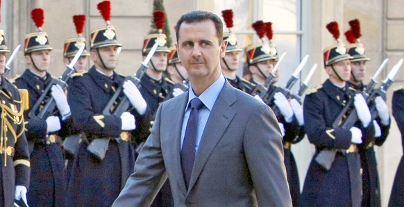 FILE - In this Dec. 9, 2010 file photo, Syria President Bashar al-Assad arrives at the Elysee Palace in Paris for his meeting with French President Nicolas Sarkozy. (AP Photo/Remy de la Mauviniere, Fi ...