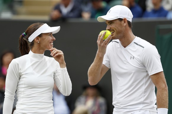 Martina Hingis of Switzerland, left, and Jamie Murray of Great Britain during their mixed doubles match against Roman Jebavy and Lucie Hradecka of Czech Republic, during the Wimbledon Championships at ...