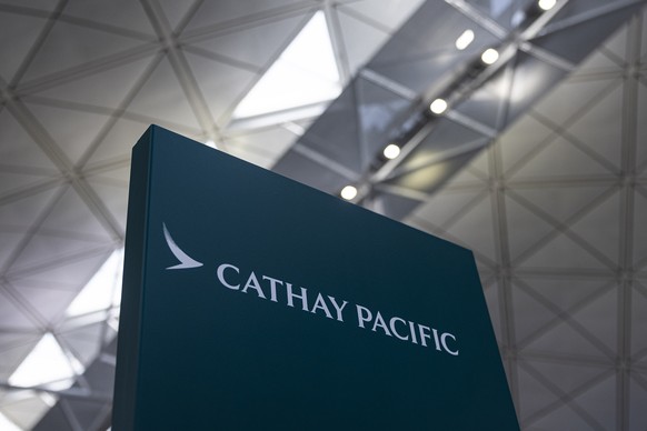 FILE - A signage for Cathay Pacific Airways at the departures hall of Hong Kong International Airport in Hong Kong, on March 8, 2023. On Tuesday, May 23, 2023, Hong Kong&#039;s Cathay Pacific Airways  ...