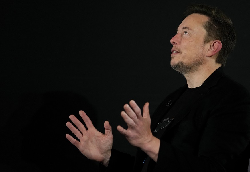 Tesla and SpaceX&#039;s CEO Elon Musk gestures during an in-conversation event with Britain&#039;s Prime Minister Rishi Sunak in London, Thursday, Nov. 2, 2023. Sunak discussed AI with Elon Musk in a  ...