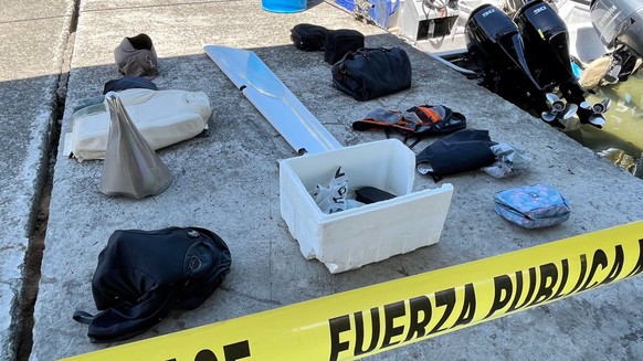 epa10259372 A handout photo made available by the Costa Rican Public Security Ministry shows elements that belong to a missing plane, in San Jose, Costa Rica, on 22 October 2022. Costa Rican authoriti ...