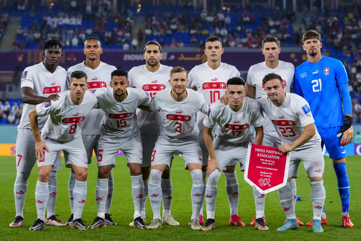 Switzerland's players line up during the World Cup group G soccer match between Serbia and Switzerland, at the Stadium 974 in Doha, Qatar, Friday, Dec. 2, 2022. (AP Photo/Petr David Josek)