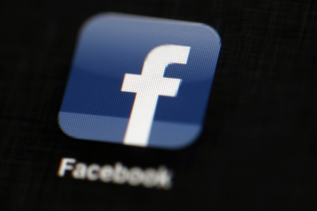 FILE - In this May 16, 2012, file photo, the Facebook logo is displayed on an iPad in Philadelphia. Facebook suspended Cambridge Analytica, a data-analysis firm that worked for President Donald Trump& ...