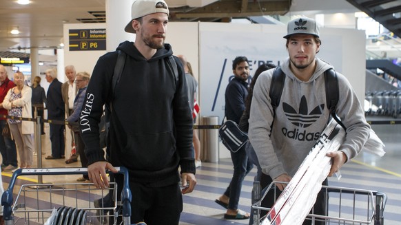 Switzerland&#039;s players defender Roman Josi, left, and forward Kevin Fiala, right, arrive to airport for take part to the IIHF 2018 World Championship, in Copenhagen, Denmark, Sunday, May 13, 2018. ...