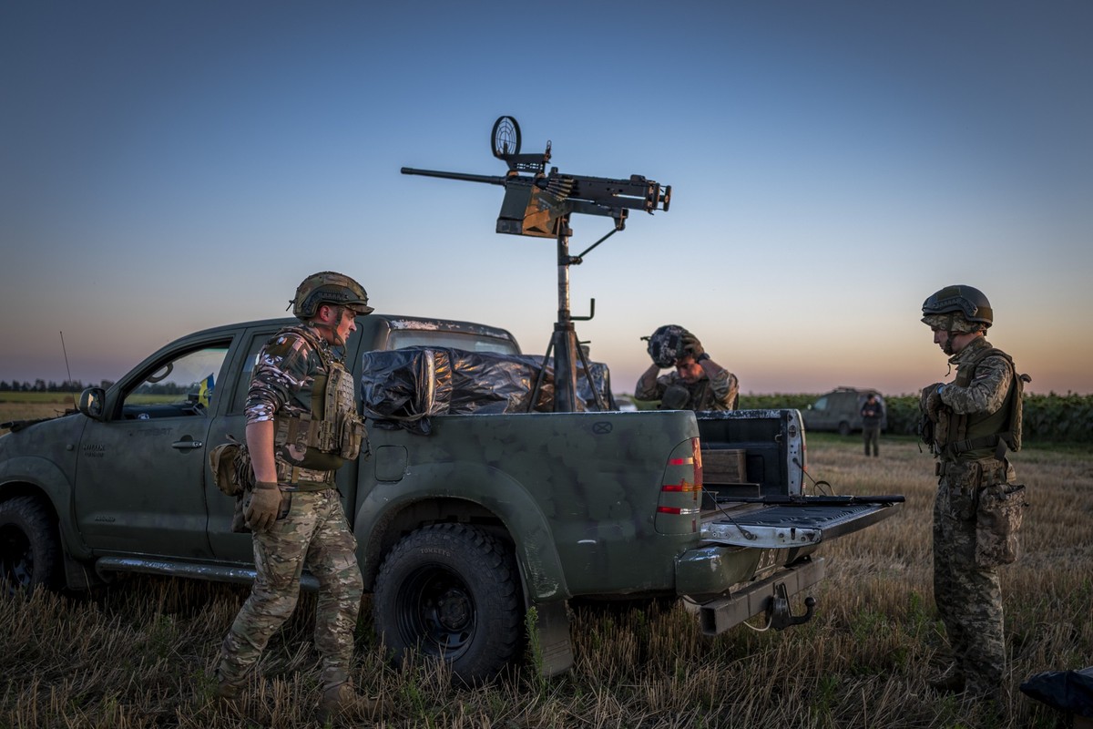 Ukrainian servicemen of the 15th Army Corps stand by an armed pickup truck during night duty in the Chernihiv region, Ukraine, late Tuesday, Aug. 12, 2025. (AP Photo/Dan Bashakov)
