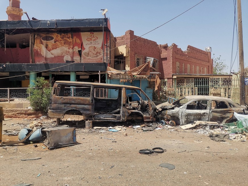 240416 -- KHARTOUM, April 16, 2024 -- This photo taken with a mobile phone on April 14, 2024 shows a view of a devastated market in Omdurman, Sudan. The market, which used to be crowded with customers ...