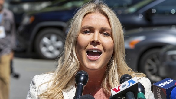 FILE - Karoline Leavitt speaks to the news media across the street from Republican presidential nominee former President Donald Trump&#039;s criminal trial in New York, May 28, 2024. (AP Photo/Ted Sha ...