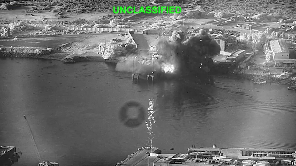 This image from video released by U.S. Central Command, shows an explosion at Bandar Abbas Naval Base, Iran, as three Corsair unmanned surface vessels, also called one-way attack surface drones, fired ...