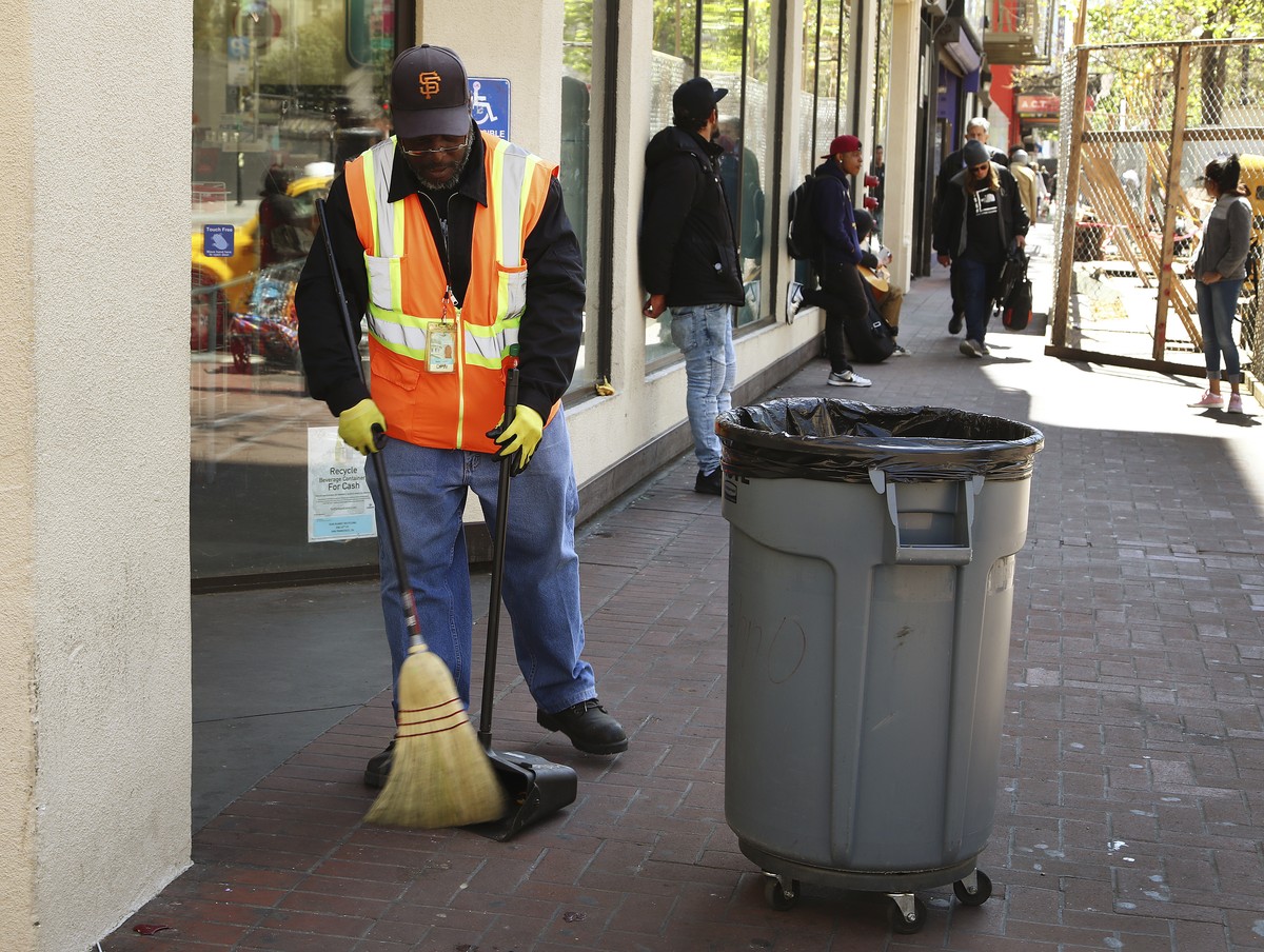 In this photo taken on Thursday, April 26, 2018, a city sanitation worker sweeps Market Street in San Francisco. San Francisco may have hit peak saturation with the stinky urine, used syringes and tra ...