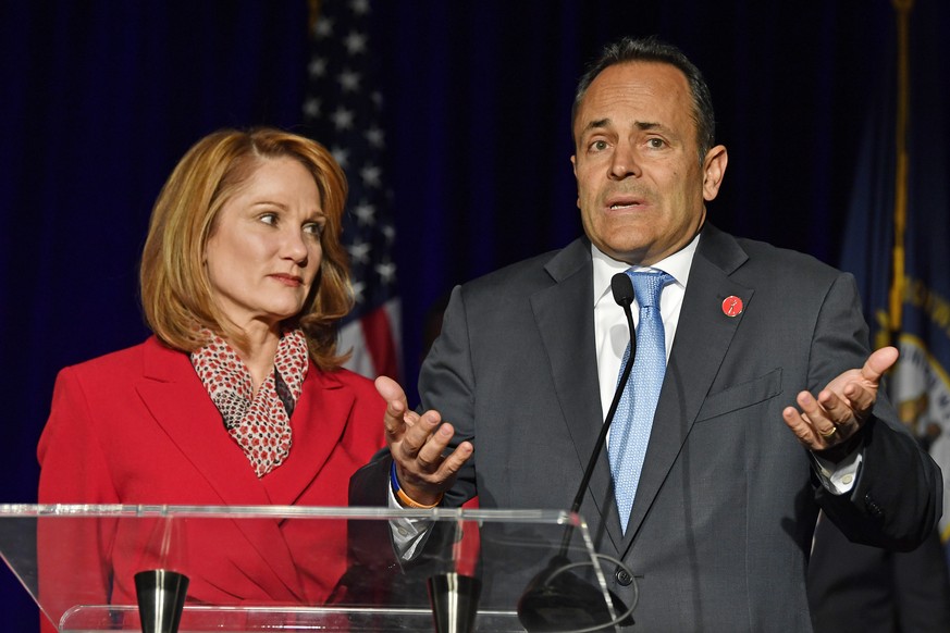 Kentucky Gov. Matt Bevin, right, with his wife Glenna, speaks to supporters gathered at the republican party celebration event in Louisville, Ky., Tuesday, Nov. 5, 2019. (AP Photo/Timothy D. Easley)