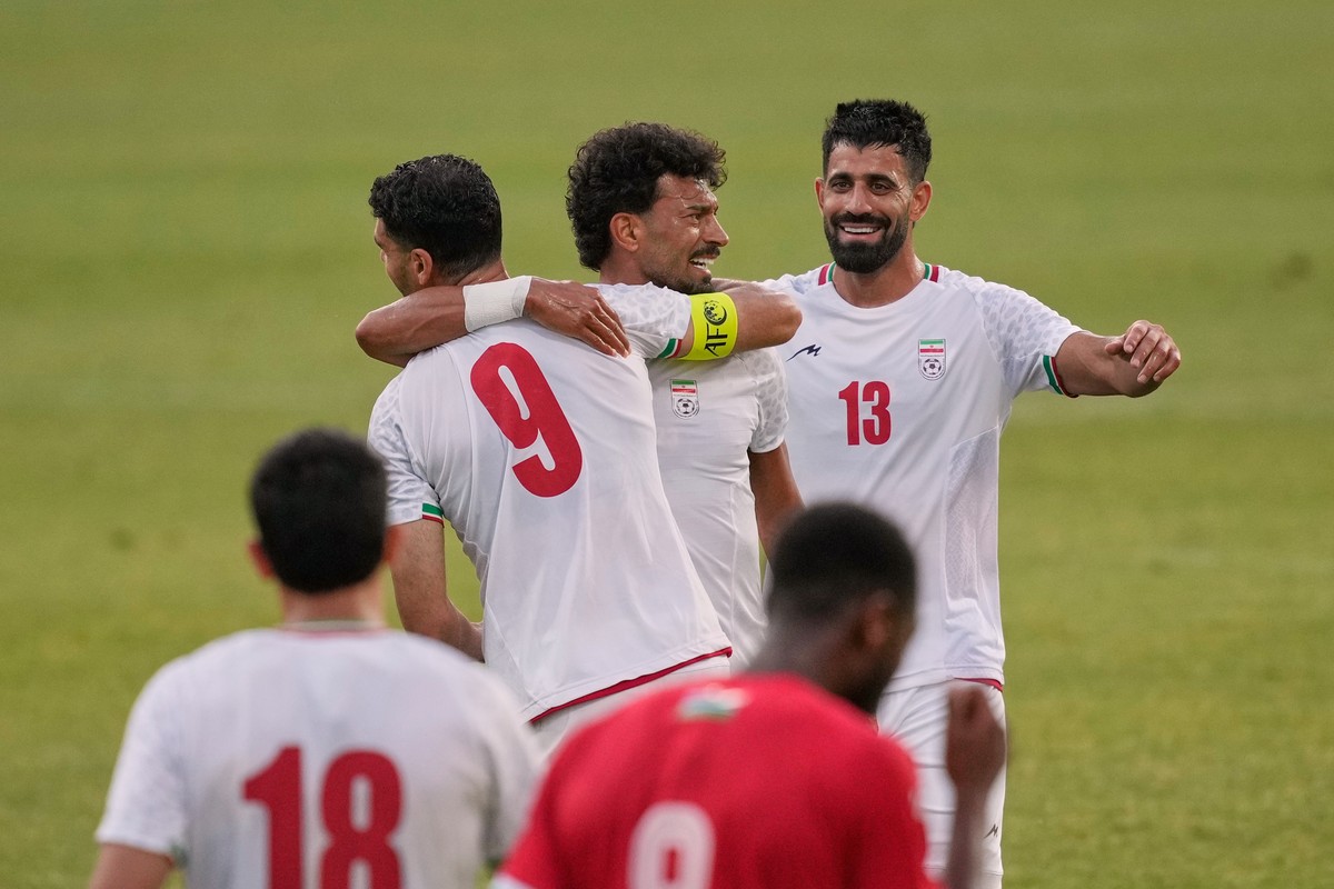 Iran's Ramin Rezaeian, center, celebrates with teammates after scoring their side's second goal during a friendly soccer match between Iran and Gambia, in Antalya, southern Turkey, Friday, M ...