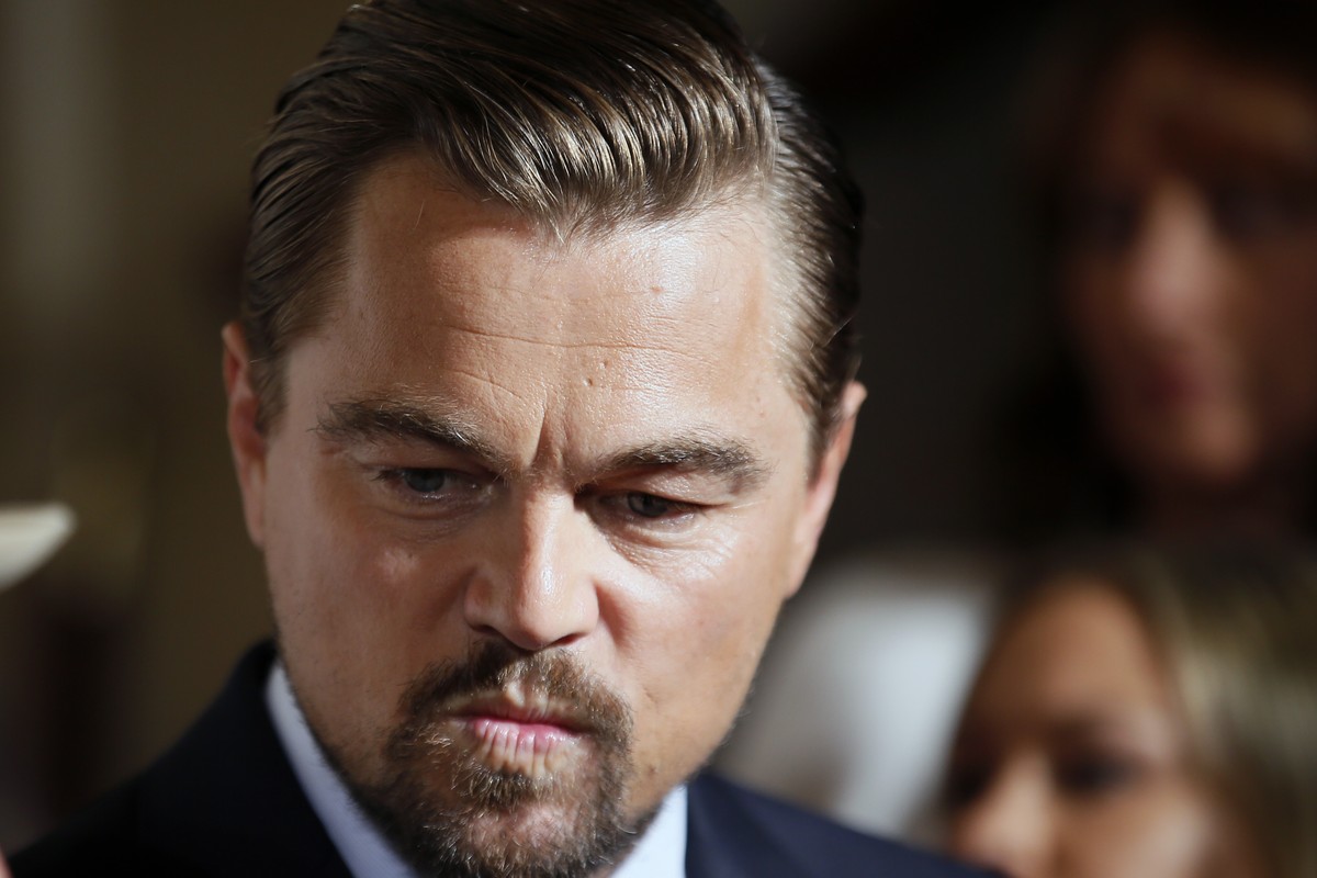 Actor Leonardo Di Caprio grimaces after a photo call for the french premiere of the film 'Before the Flood', ('Avant Le Deluge') at Chatelet Theater in Paris, Monday Oct. 17, 2016. ...