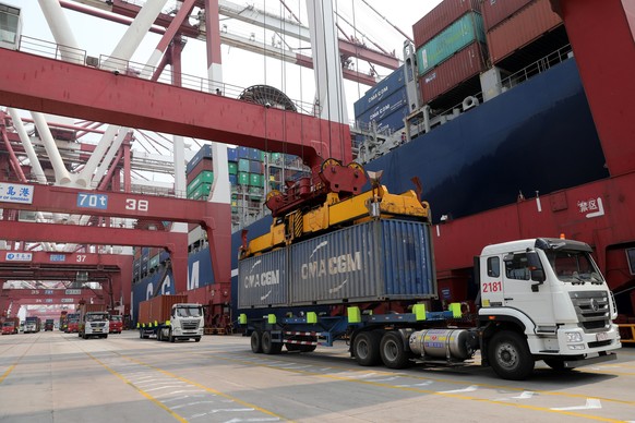 epa06866949 (FILE) - Trucks transport containers at the Port of Qingdao in Qingdao, China's Shandong province, 30 April 2018 (reissued 06 July 2018). According to media reports on 06 July 2018, US bus ...