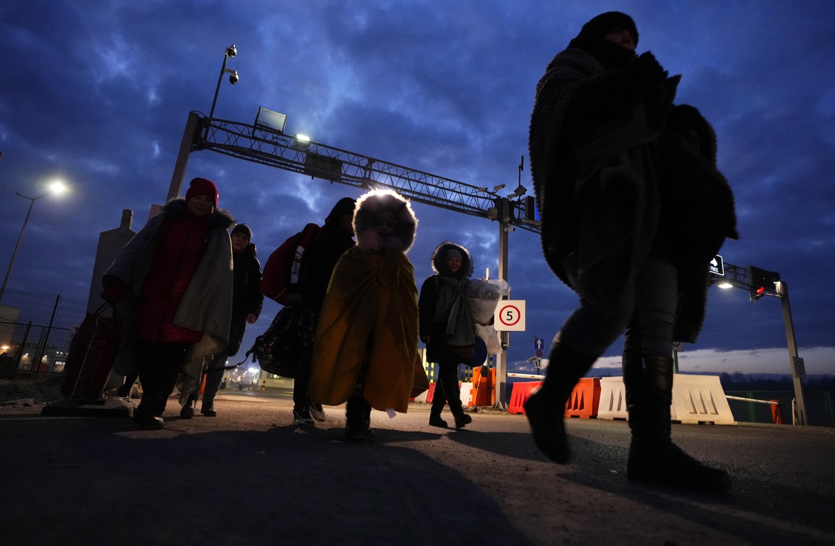 FILE - Refugees fleeing conflict in neighboring Ukraine arrive to in Przemysl, Poland, Feb. 27, 2022. Nearly a year has passed since the Feb. 24, 2022, invasion sent millions of people fleeing across  ...