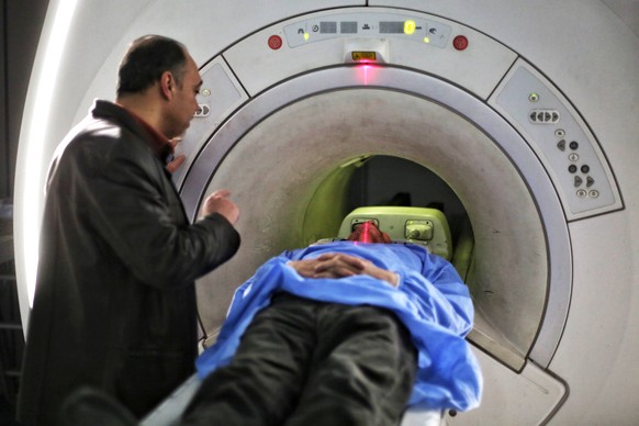 epa11880303 A Syrian doctor checks an MRI scan of a patient at Almujtahid hospital in Damascus, Syria, 06 February 2025 (issued 07 February 2025). According to Damascus Health Director Dr. Muhammad Ak ...