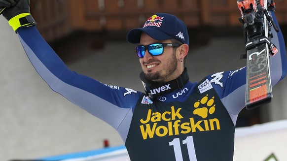Italy's Dominik Paris celebrates winning an alpine ski, men's World Cup downhill, in Bormio, Italy, Friday, Dec. 27, 2019. (AP Photo/Alessandro Trovati)