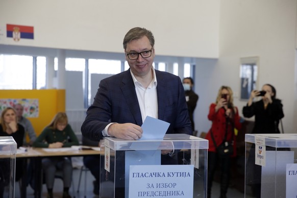 epaselect epa09867062 Incumbent Serbian President Aleksandar Vucic casts his ballot during the general elections in Belgrade, Serbia, 03 April 2022. Voters in Serbia are voting for the members or Parl ...