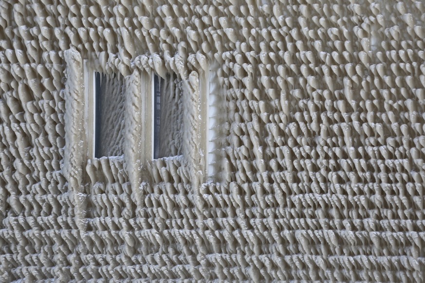 A house along Hoover Beach is covered by ice from high winds and from the waves from Lake Erie, Saturday, Feb. 29, 2020, in Hamburg N.Y. Blowing snow has fallen around the state since Thursday, though ...