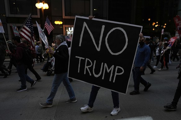 People march during Illinois Coalition for Immigrant &amp; Refugee Rights&#039; &quot;Chicago Says No Trump No Troops&quot; protest Saturday, Sept. 6, 2025, in Chicago. (AP Photo/Carolyn Kaster)
Trump ...