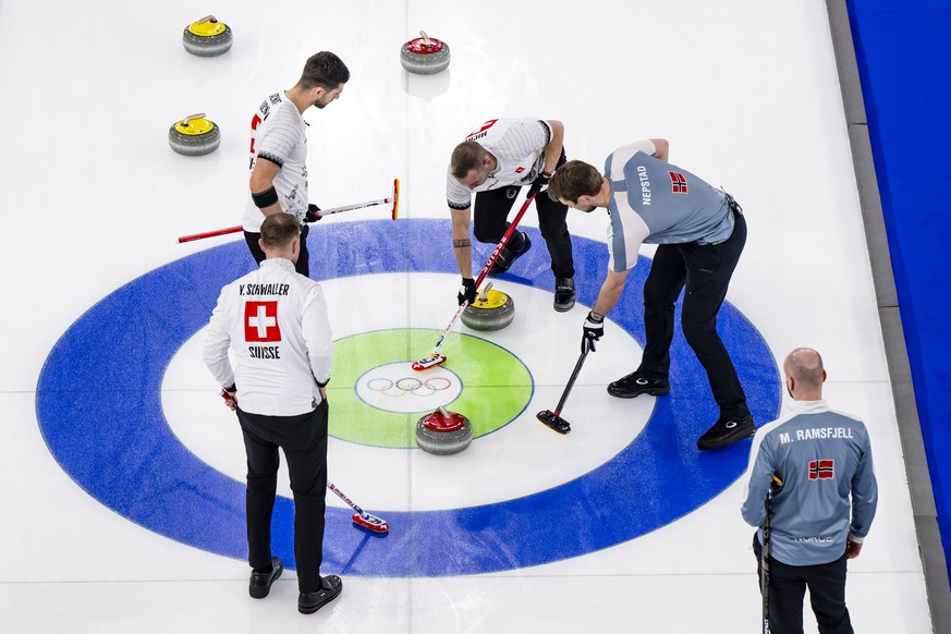 Yannick Schwaller, Pablo Lachat-Couchepin and Sven Michel of Switzerland, from left to right, in action during the men's curling bronze medal game between Switzerland and Norway at the 2026 Olymp ...