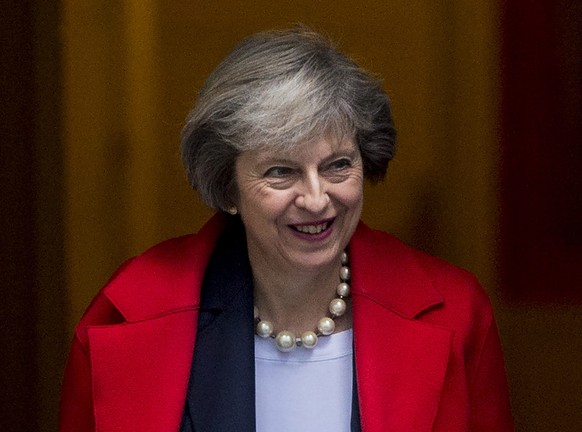 epa05675011 British Prime Minister Theresa May leaves No. 10 Downing Street in London, Britain, 14 December 2016. The Prime Minister left her residence to attend the Prime Minister&#039;s Questions Ti ...