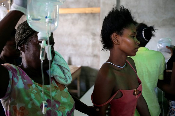 A woman with symptoms of cholera walks in the Cholera Treatment Center at the Immaculate Conception Hospital in Les Cayes, Haiti, November 8, 2016. Picture taken November 8, 2016. REUTERS/Andres Marti ...