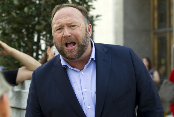 FILE- In this Sept. 5, 2018, file photo conspiracy theorist Alex Jones speaks outside of the Dirksen building of Capitol Hill after listening to Facebook COO Sheryl Sandberg and Twitter CEO Jack Dorse ...