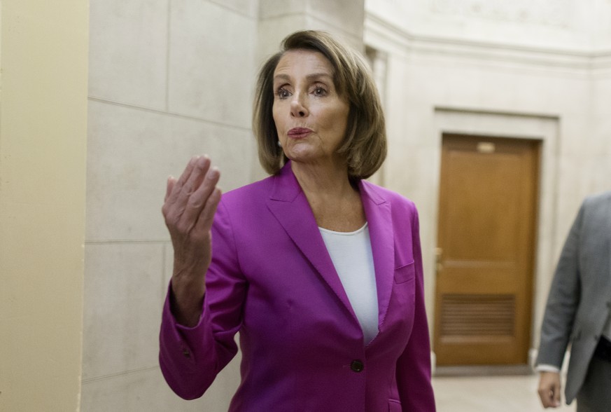 epa07276098 US Speaker of the House Democrat Nancy Pelosi pauses at the entrance to her office to briefly speak with members of the news media on the partial shutdown of the federal government, follow ...