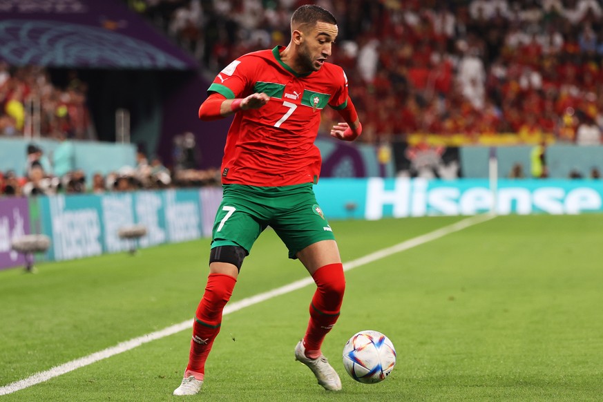 epa10351960 Hakim Ziyech of Morocco in action during the FIFA World Cup 2022 round of 16 soccer match between Morocco and Spain at Education City Stadium in Doha, Qatar, 06 December 2022. EPA/Mohamed  ...